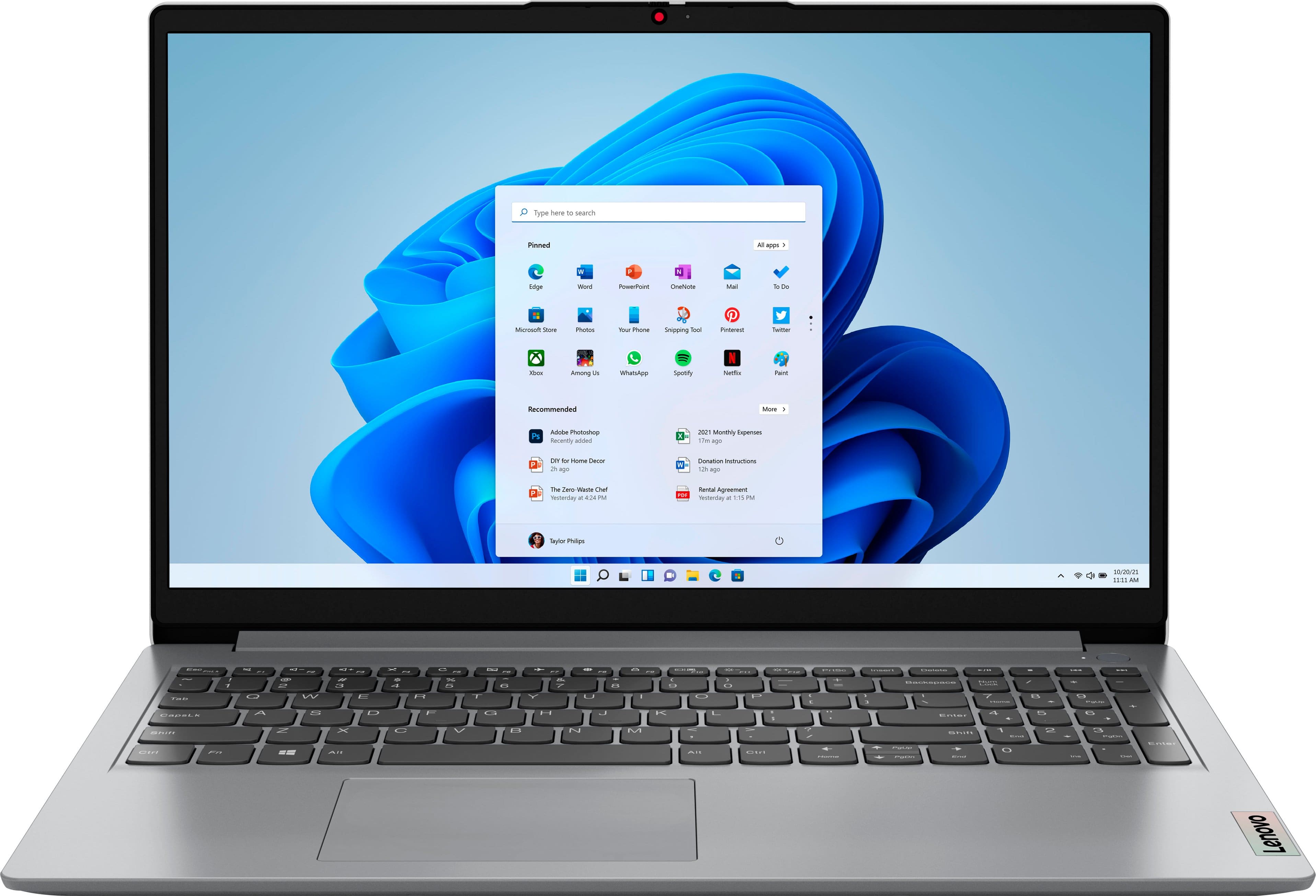 Lenovo Ideapad 1 laptop displaying a web browser on a desk
